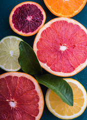 citrus fruits slice top view wood background.