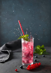 glasscurrant  berry water dark background splash.