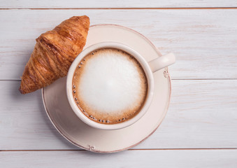 coffe and croissant wood background morning breakfast top view