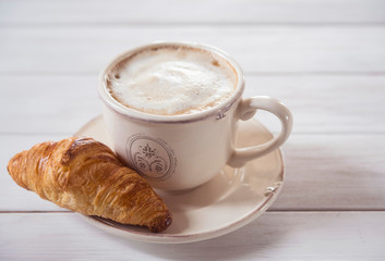 coffe and croissant wood background morning breakfast