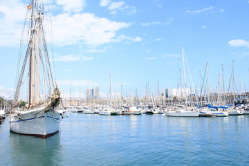 Fototapeta premium Sail boat in Marina Port Vell, a waterfront harbor in Barcelona, Catalonia, Spain