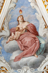 ACIREALE, ITALY - APRIL 11, 2018: The fresco of Love cardinal virtue in church Chiesa di San Camillo by Pietro Paolo Vasta (1745 - 1750).