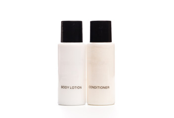 Hotel cosmetic bottles isolated on white