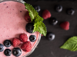 raspberry and blueberry smoothie with mint top view