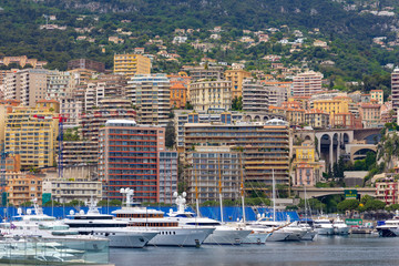 Apartments and luxury yachts in the harbor of Monte Carlo, Monaco, Europe.