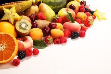 Naklejka na ściany i meble Fresh summer fruits with apple, peach, papaya, berries, pear and apricot.