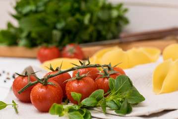 tomato cherry, pasta, basil wood table