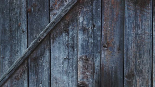 Real Old Wood Texture Vintage Background. Dark background. The camera moves from right to left.