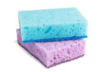 Obraz na płótnie Canvas Colored sponges for washing dishes and other domestic needs. Blue sponge lies on a violet sponge at a slight angle. Isolate