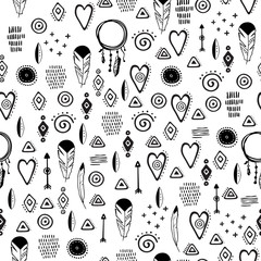 Hand drawn seamless pattern with cute tribal elements in simple style. Cute cartoon textured pattern. Vector.