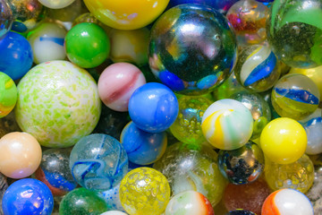 Glass marbles of different colors and sizes