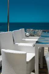 White chairs on the sea