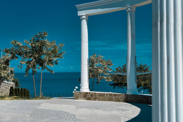 white columns by the sea