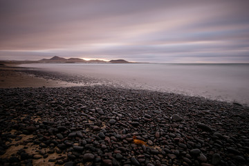 sea landscape which was created on the famous Famara beach in Lanzarote, long shutter speed