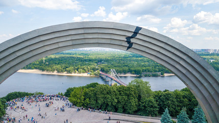Panoramic view of Kyiv. Arch of Peoples Friendship, pedestrian bridge. View of Kyiv with a dron