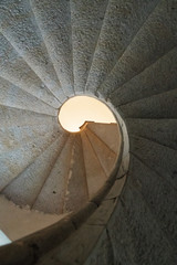 Padula, Salerno, Campania, Italy - April 21, 2019: Detail of the helical stone staircase leading to the library of the Certosa di San Lorenzo