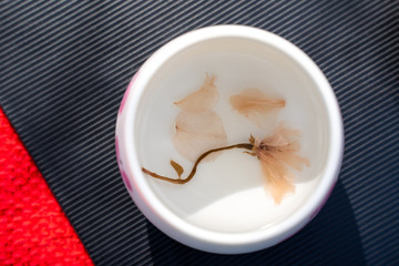 Cherry blossom tea (Sakurayu or Sakura-cha) Japanese infusion created by seeping pickled cherry blossoms with boiled water. Sakura tea