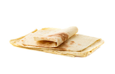 Thin pita bread on a white background. Armenian pita bread close-up.