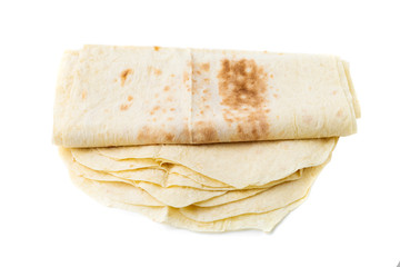 Thin pita bread on a white background. Armenian pita bread close-up.