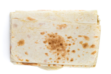 Thin pita bread on a white background. Armenian pita bread close-up.