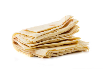 Thin pita bread on a white background. Armenian pita bread close-up.