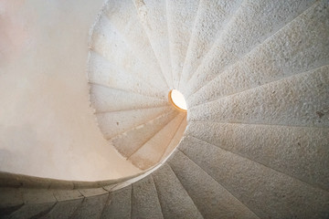 Padula, Salerno, Campania, Italy - April 21, 2019: Detail of the helical stone staircase leading to the library of the Certosa di San Lorenzo