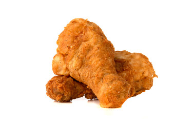 Fried legs on a white background. Chicken legs deep fried close-up.