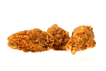 Fried wings on a white background. Deep-fried chicken wings close-up.
