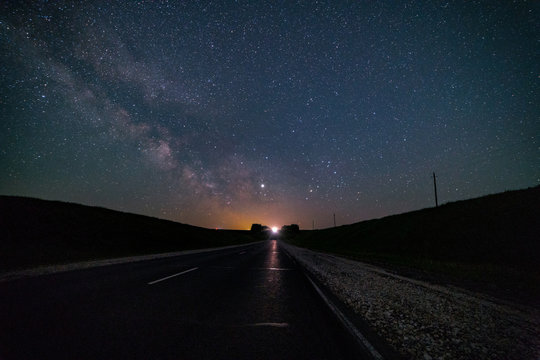 The Milky Way, over the road that goes into the distance.