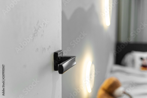 Modern Chrome Door Handle And Lock On White Wooden Door