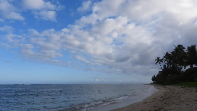 Time Lapse Moving Clouds at Kahala Beach in Honolulu on the island of Oahu, Hawaii.