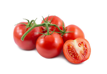 The branch of tomatoes is isolated on a white background