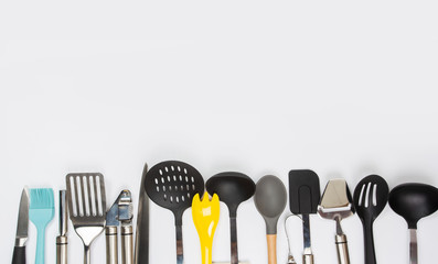 different kitchenware on a gray background top view. Cooking appliances.