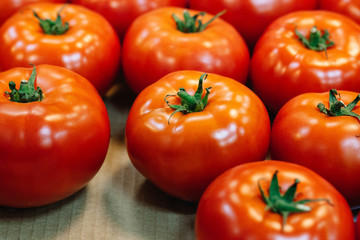 Fresh organic, hand-picked ripe tomatoes for sale at a roadside farmer's market