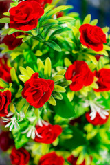 Red flower bouquets of fake roses