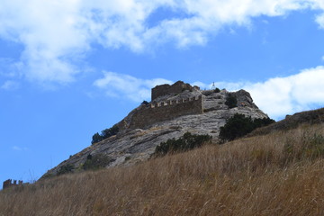 Genoese fortress in Sudak. Rock with part of the fortress wall.