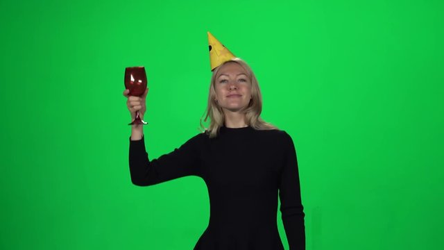 Woman having fun on birthday. Green screen