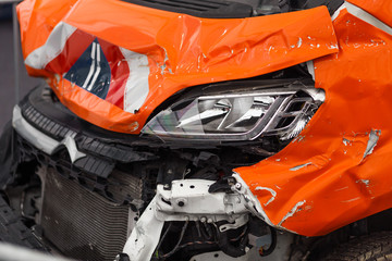 Detail of damaged car chasis after dangerous car crash with torn and wringled metal all over the...