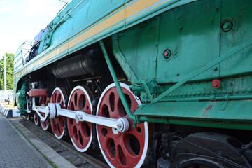 The wheels of an old steam locomotive.