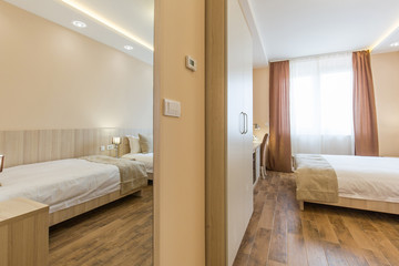 Hotel room interior,double bed beige bedroom