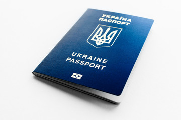 biometric passport of the citizen of Ukraine on the white table