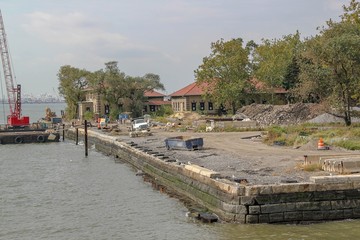 View of constraction zone on Ellis island. Historical places background. USA. New York.
