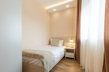 Hotel room interior,double bed beige bedroom