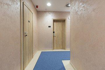 Hotel corridor with apartment doors