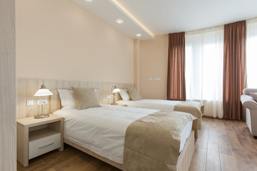 Fototapeta na wymiar Hotel room interior,double bed beige bedroom