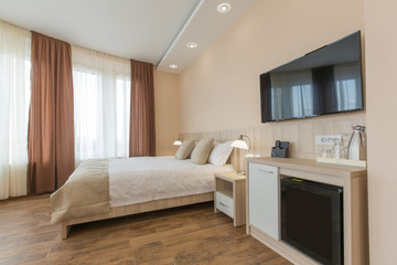 Hotel room interior,double bed beige bedroom