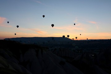 Hot air balloons over Goreme, Turkey, before sunrise.