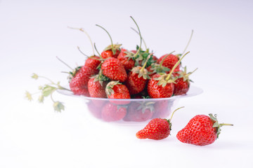 plate with strawberries on a white background