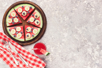 Fototapeta na wymiar Fresh watermelon pizza and smoothie on grey background