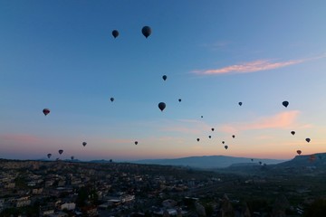 Hot air balloons over Goreme, Turkey, before sunrise.